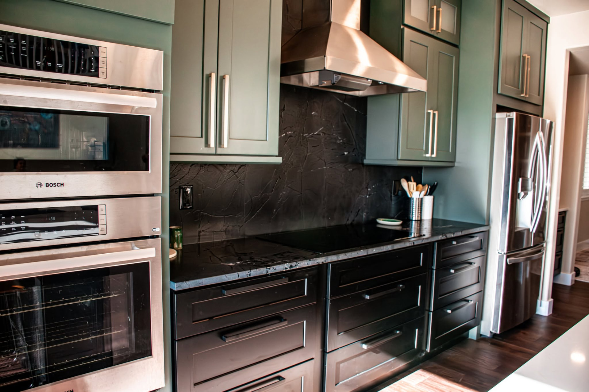 Completed kitchen remodel with integrated appliances by Revive